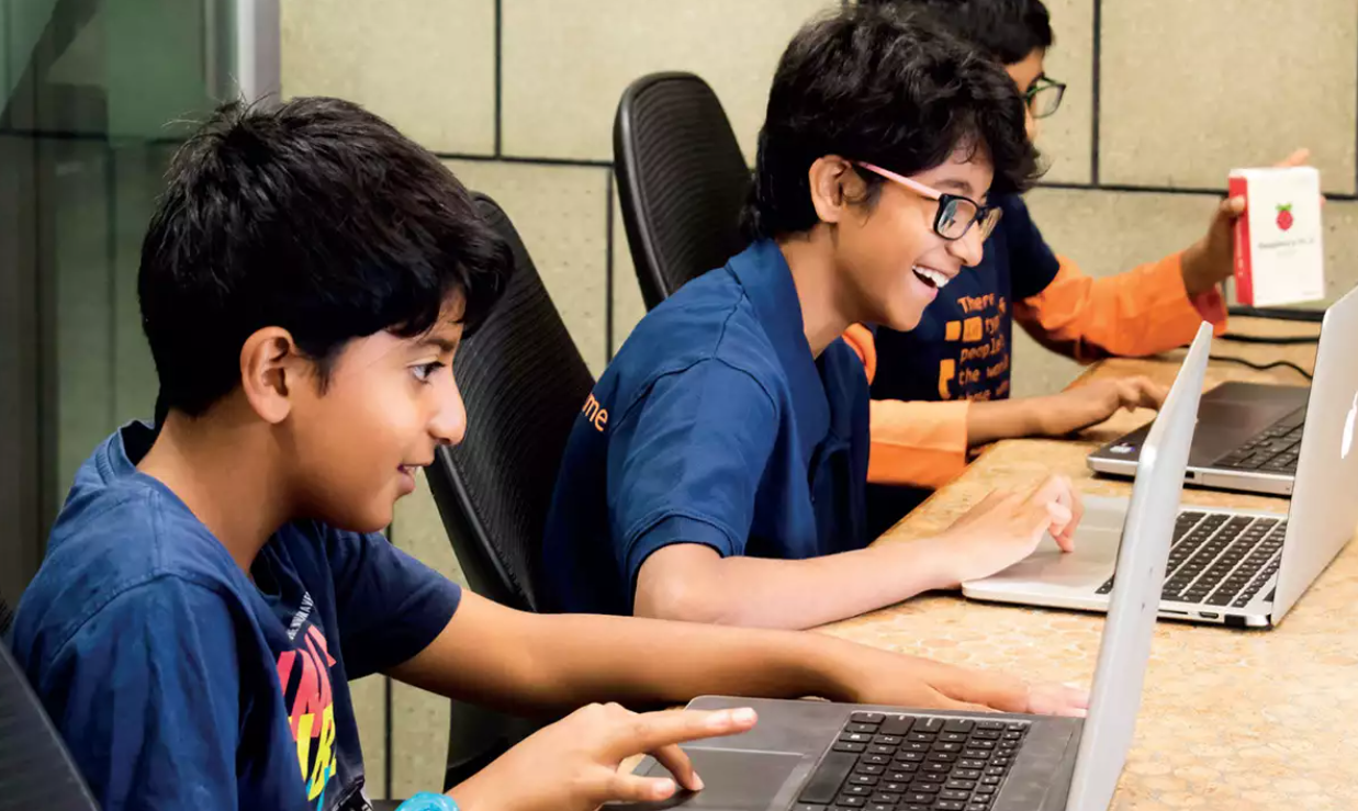 Indian student learning AI through creative coding on laptop – AImagine.in